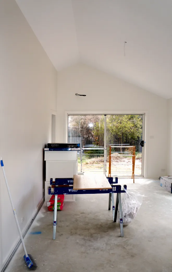 Building interior with raked ceiling showing construction nearly completed