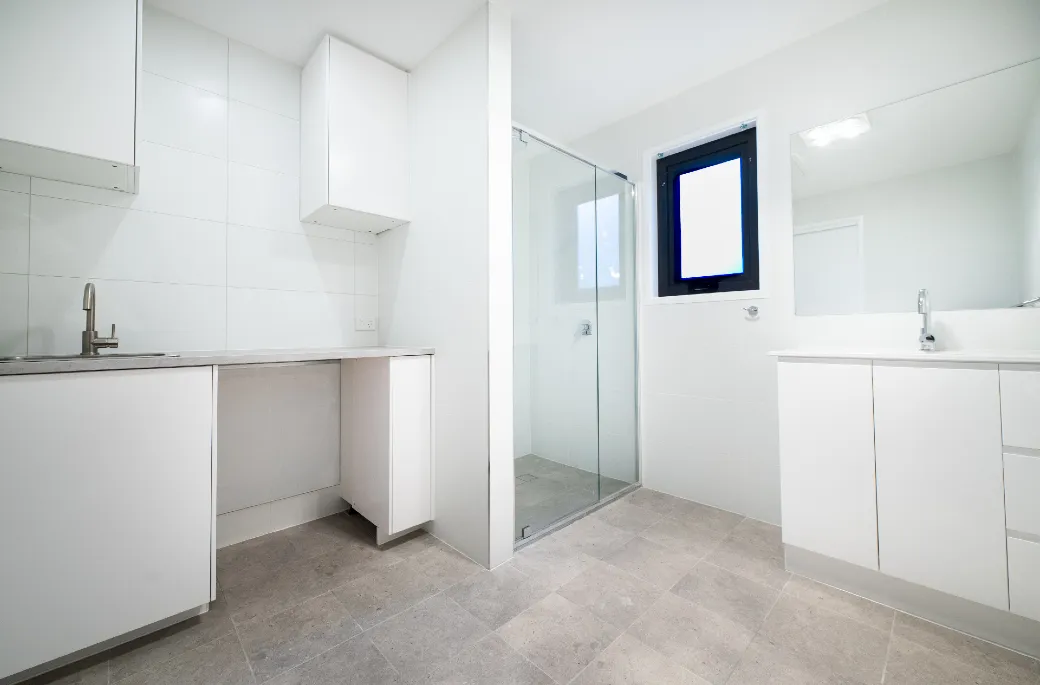 A combined bathroom and laundry