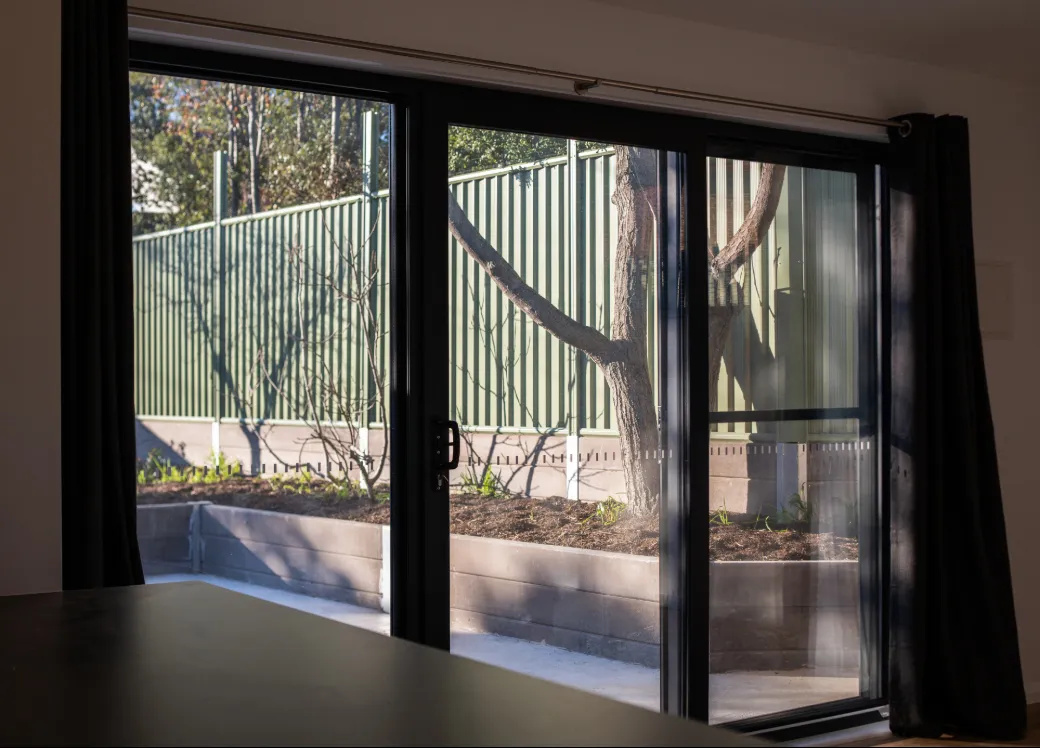 Sliding glass door looking out new alfresco area